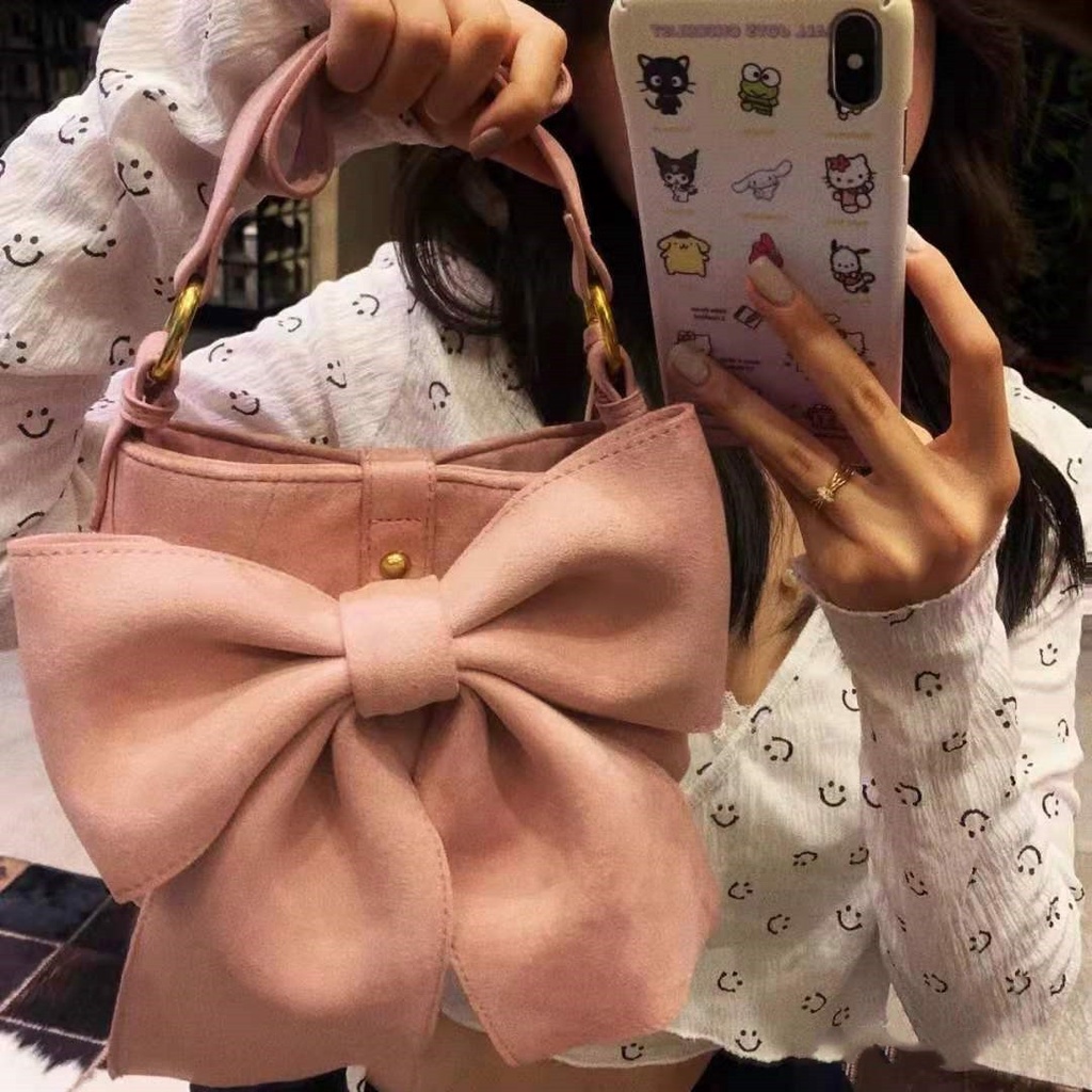 Túi bucket kẹp nách dáng nơ màu hồng pastel chất liệu nhung trơn 6976 - Unip
