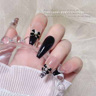 charm nơ trắng đen nail