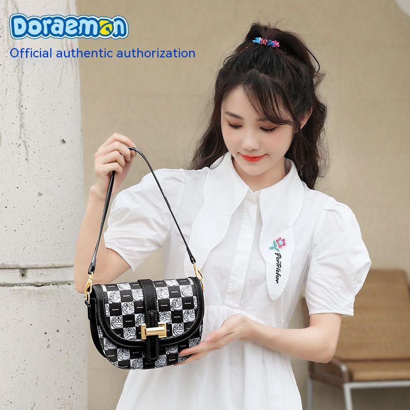 Doraemon túi đeo vai nhỏ nữ niche Pháp nhẹ nhàng túi đeo chéo giá trị cao túi yên ngựa túi điện thoại di động