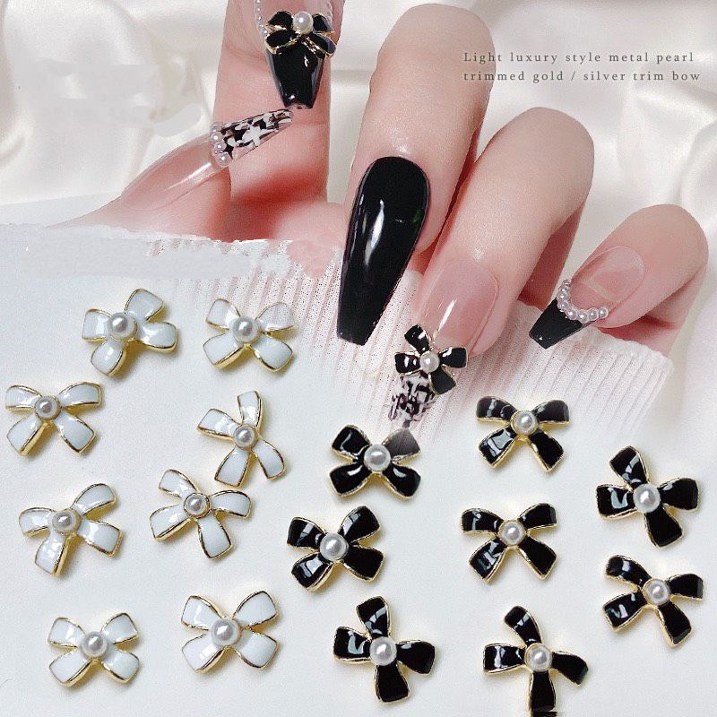 charm nơ trắng đen nail