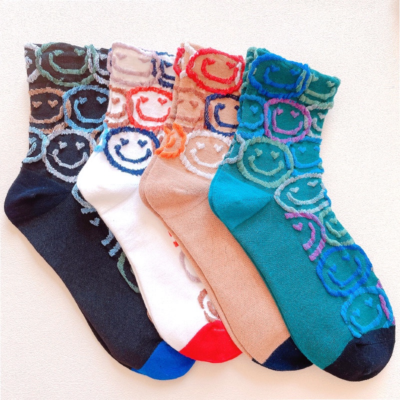Korean version of net red smiling face socks women fall and winter tube ins tide everything goes together bubble pile pile socks college style new women's socks