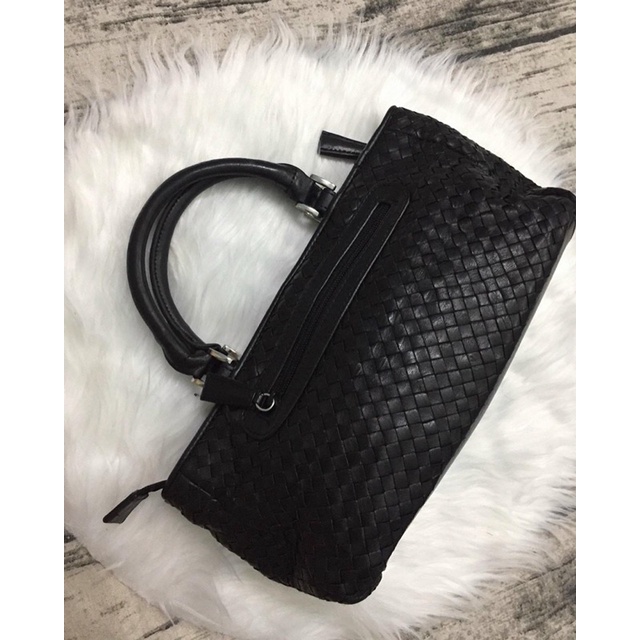 Túi cầm tay da đan