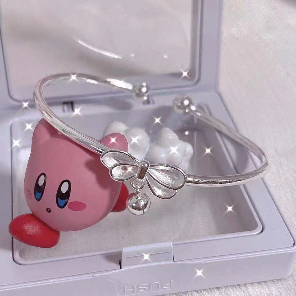 Vòng tay AY màu bạc đính chuông và nơ ngọt ngào cho nữ