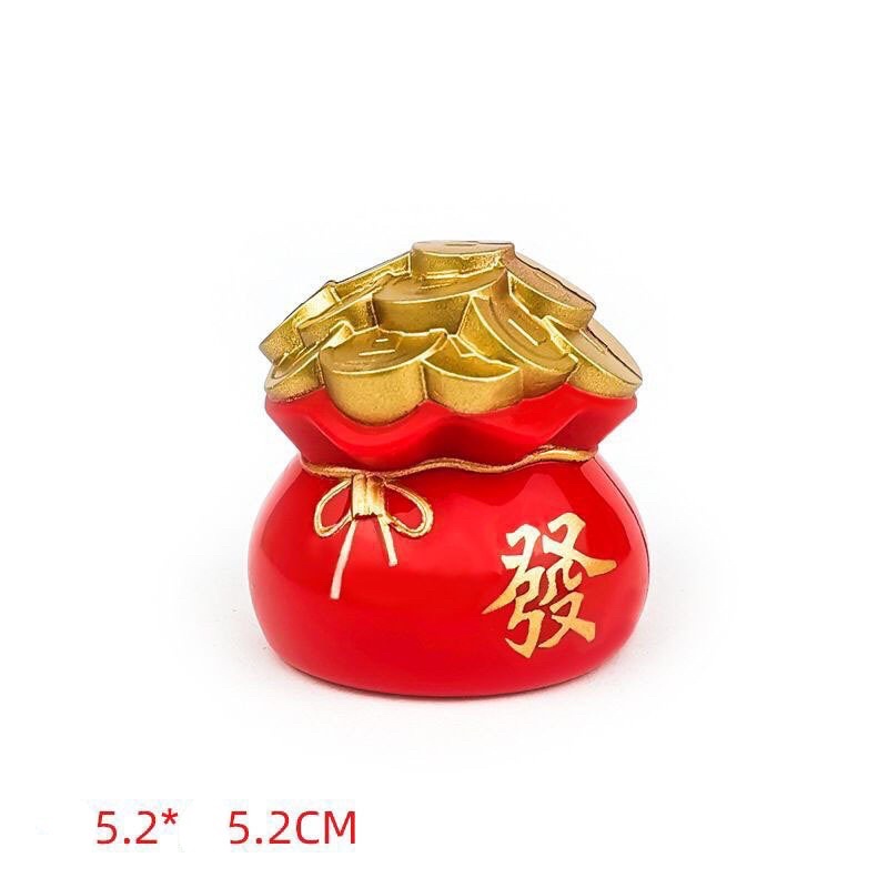 Thần tài, túi vàng trang trí bánh kem