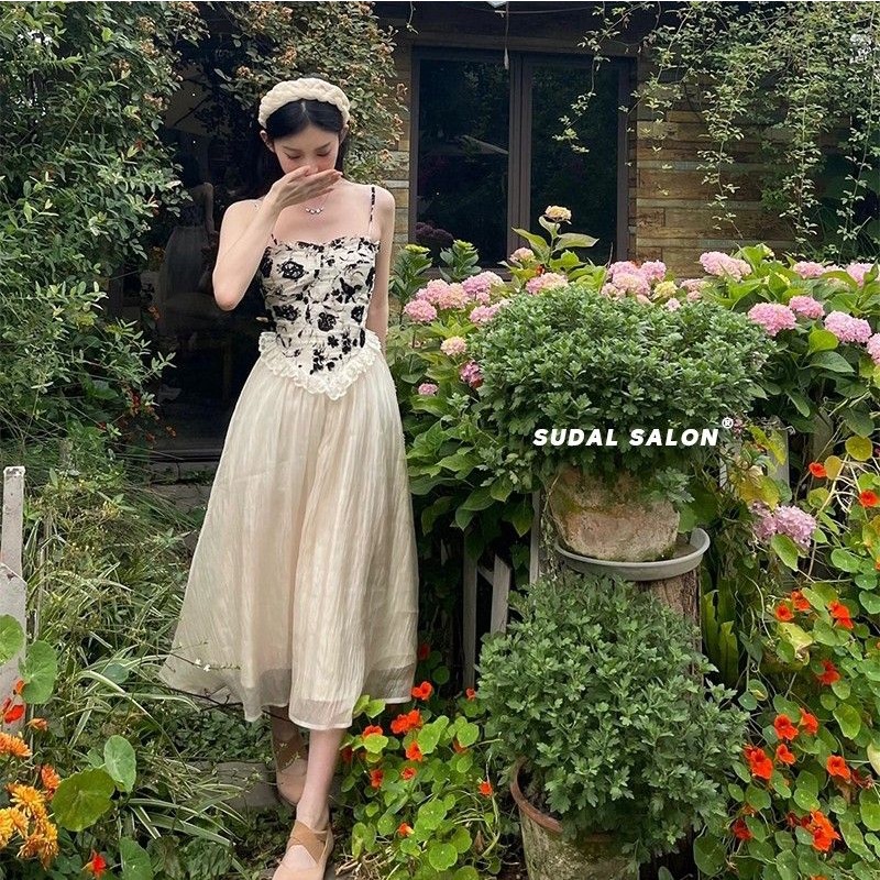 Váy hai dây đen da báo kiểu corset voan trắng