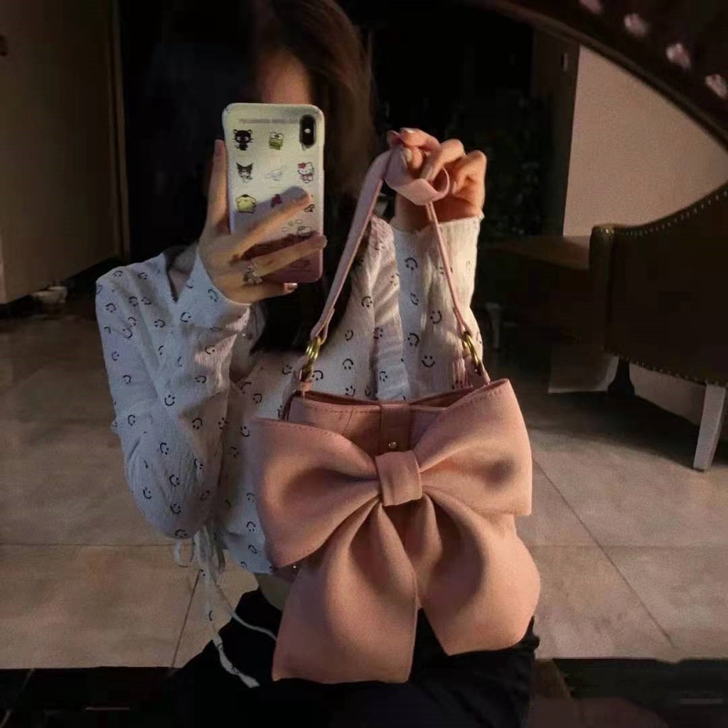 Túi bucket kẹp nách dáng nơ màu hồng pastel chất liệu nhung trơn 6976 - Unip