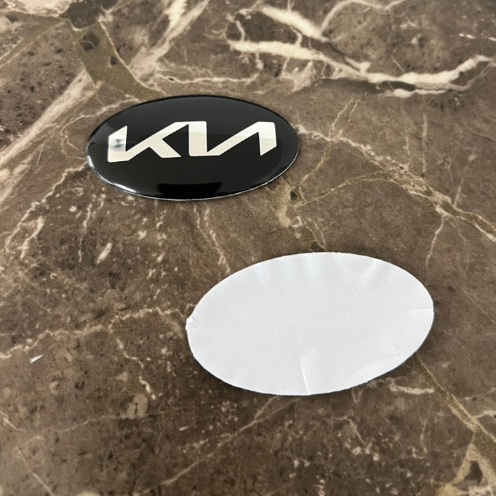 Logo biểu tượng vô lăng xe ô tô KIA, kích thước 60x30mm