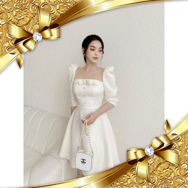 ĐẦM TRẮNG KEM CỔ VUÔNG ĐÍNH NƠ NÚT TAY LỞ