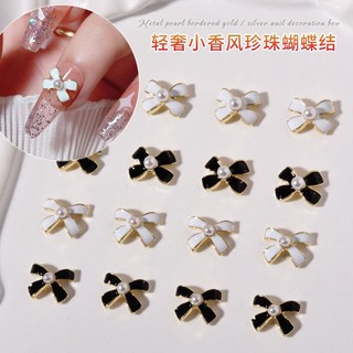 charm nơ trắng đen nail