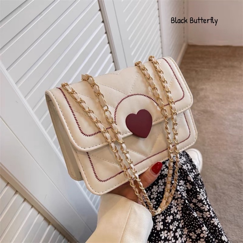 Túi đeo chéo họa tiết trái tim Butterfly