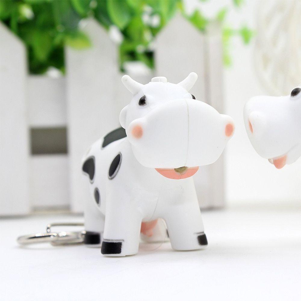 Móc Khóa Hình Bò Sữa Mini Có Đèn LED Cảm Ứng