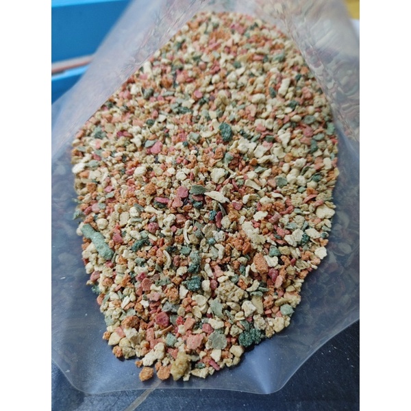 100gr Thức ăn nén dạng vảy cho chim vẹt nhỏ .