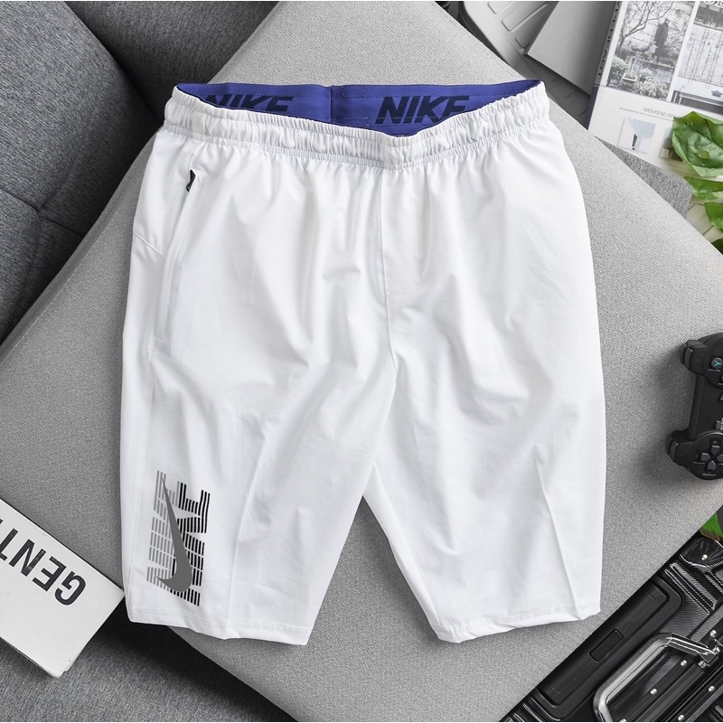 Quần short thể thao nam chất dù giãn nhẹ mát, ba túi có khóa kéo