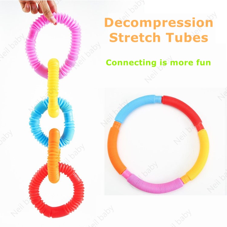 Đồ chơi ống lò xo pop đèn led sáng kéo dài giảm căng thẳng