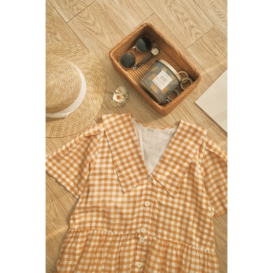 Đầm babydoll caro vàng vải xô