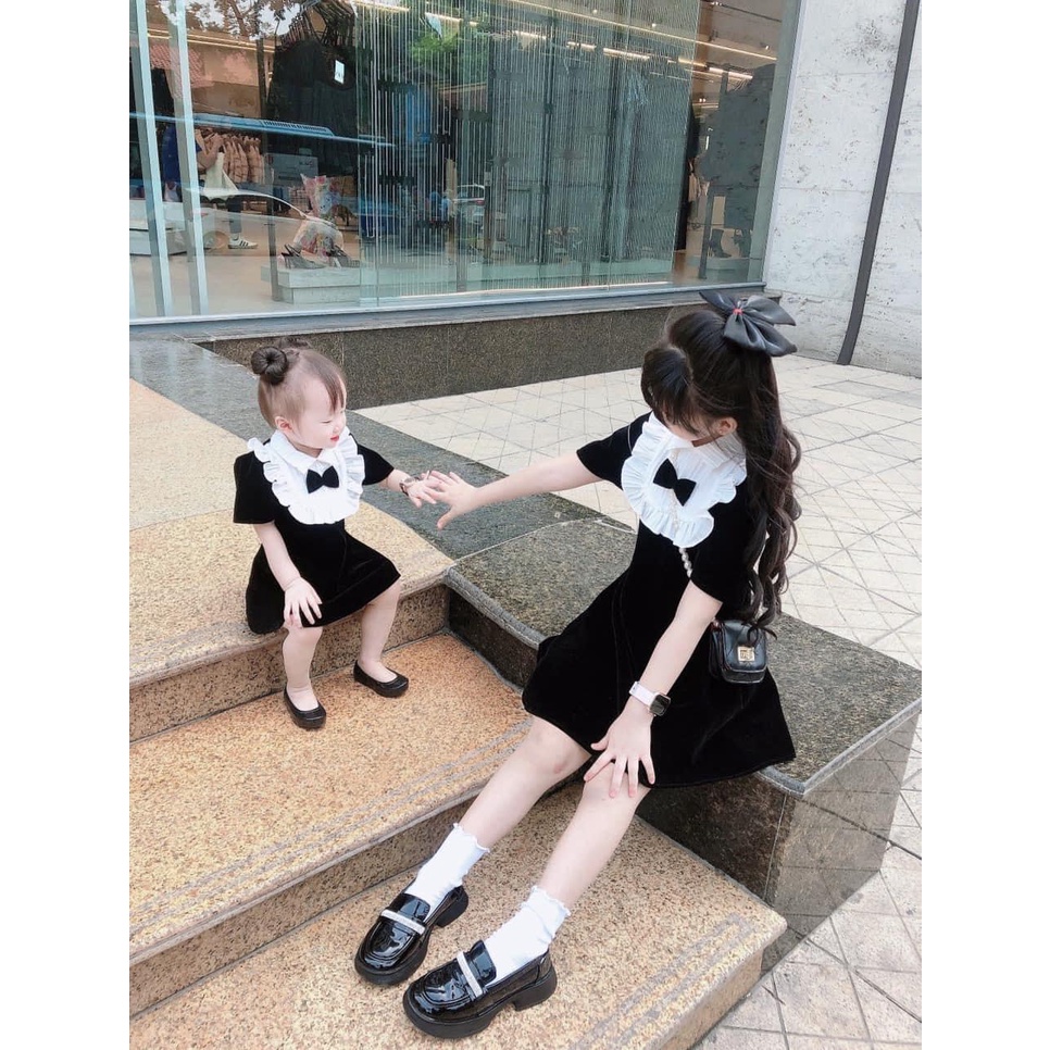 BÁN SỈ VÁY NHUNG ĐEN BÉ GÁI CỔ SƠ MI TRẮNG BÈO NƠ ĐEN