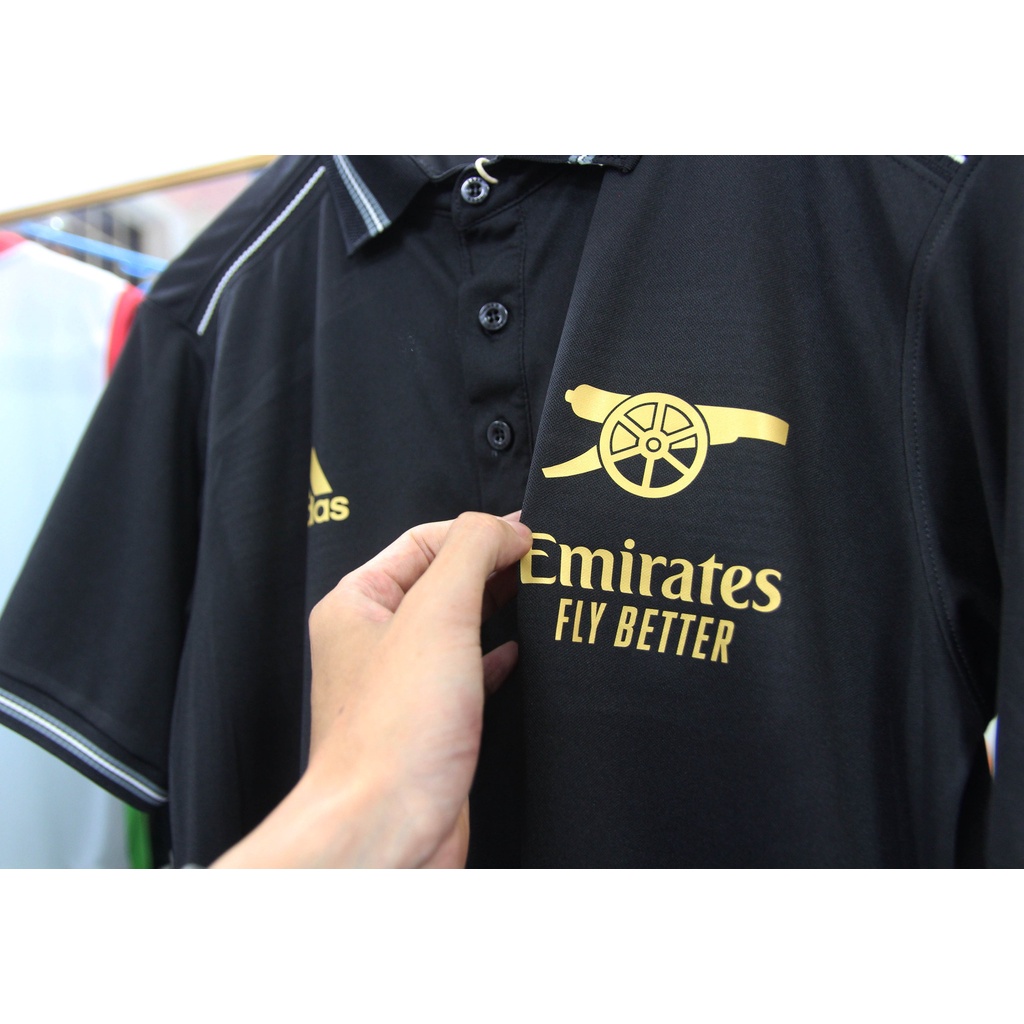 Áo polo Arsenal đen logo vàng kim 2022-2023