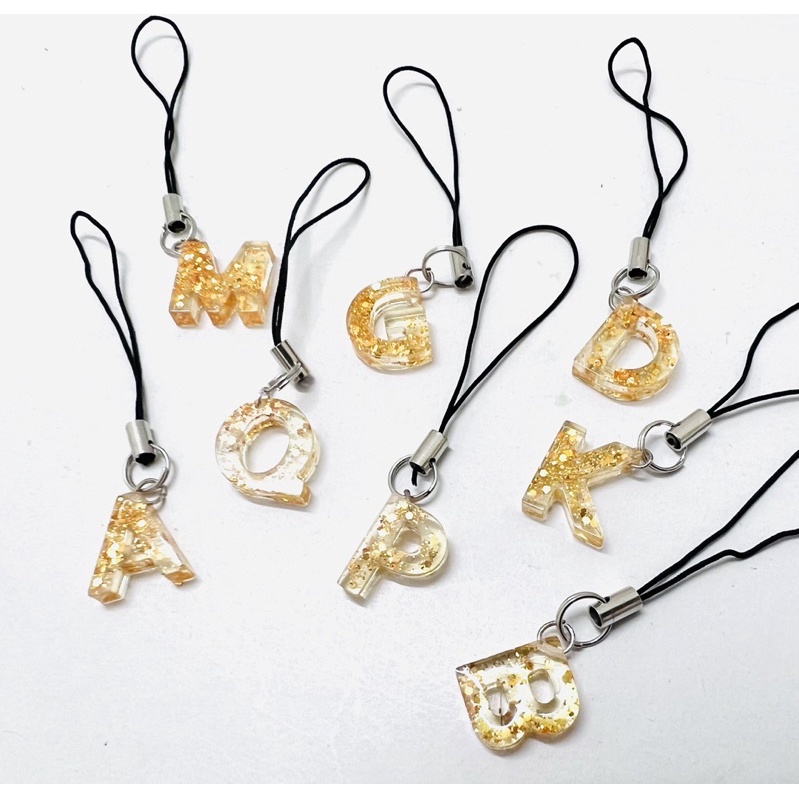 Móc khóa dây chữ cái nhũ vàng keo epoxy trong suốt