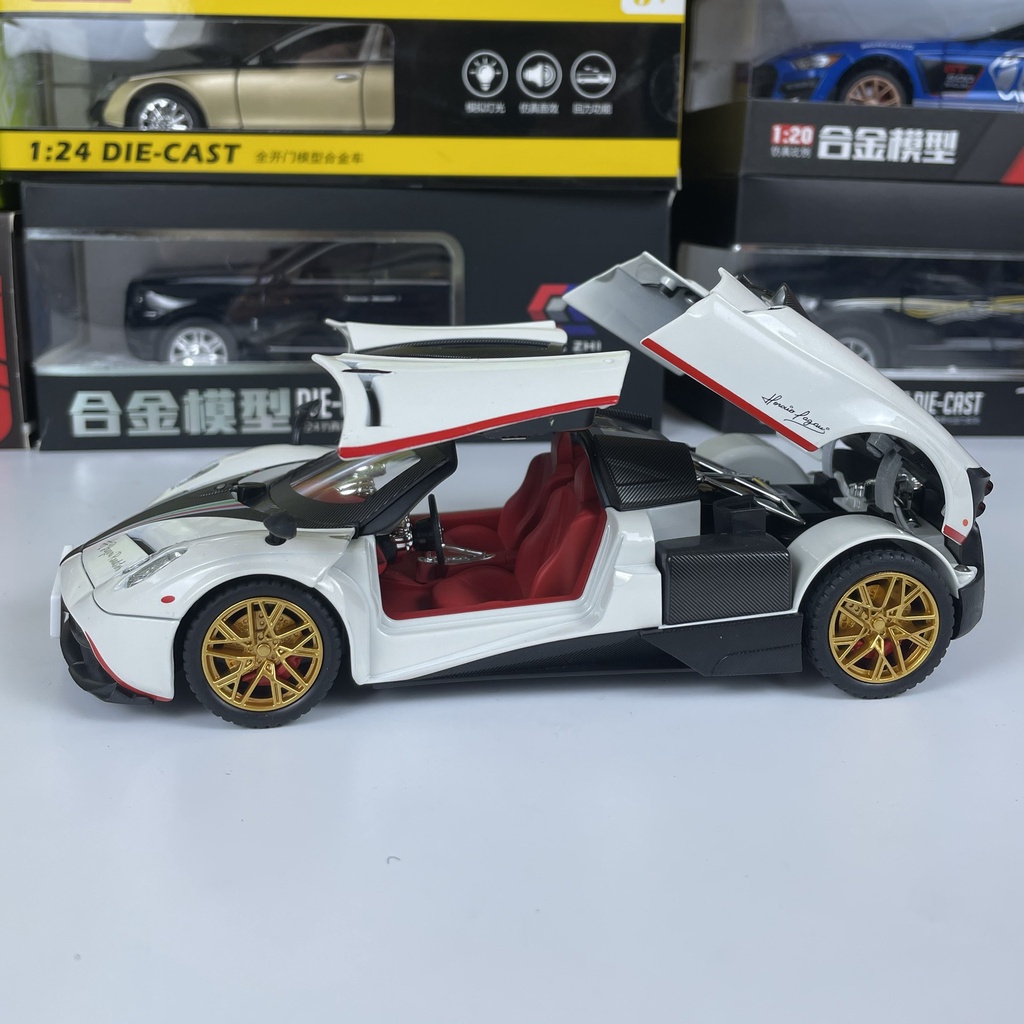 Mô hình siêu xe THẦN GIÓ Pagani Huayra Roadster tỷ lệ 1:24 mở full cửa có đèn, âm thanh, vô lăng đánh lái bấm còi