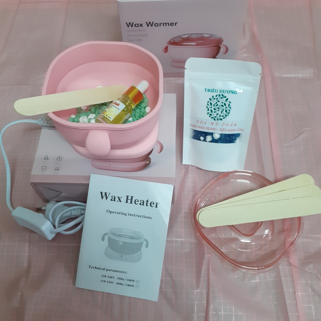 1 nồi nấu sáp wax lông silicon bỏ túi + sáp 50g màu Triêu Dương + Mỡ trăn 10ml. Tặng que wax
