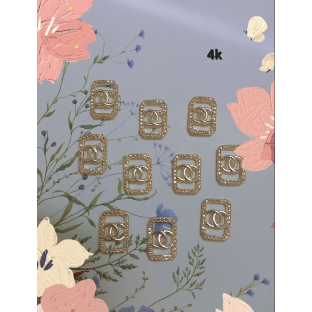 Charm kim loại đồng giá 4k 1 viên