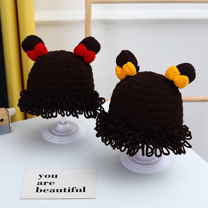 Mũ Len Trùm Đầu Đính Nơ Và Tóc Giả Cho Bé