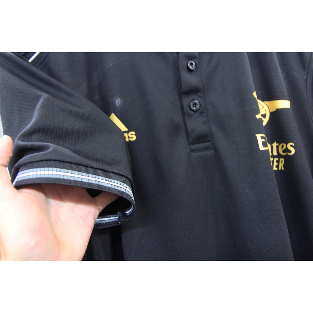 Áo polo Arsenal đen logo vàng kim 2022-2023