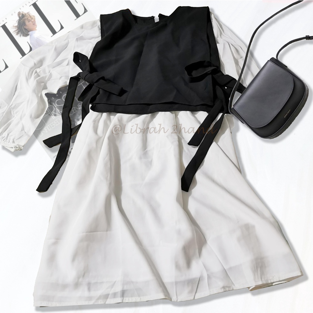 Set váy trắng tay bồng kèm áo gile buộc nơ đen (Freesize)