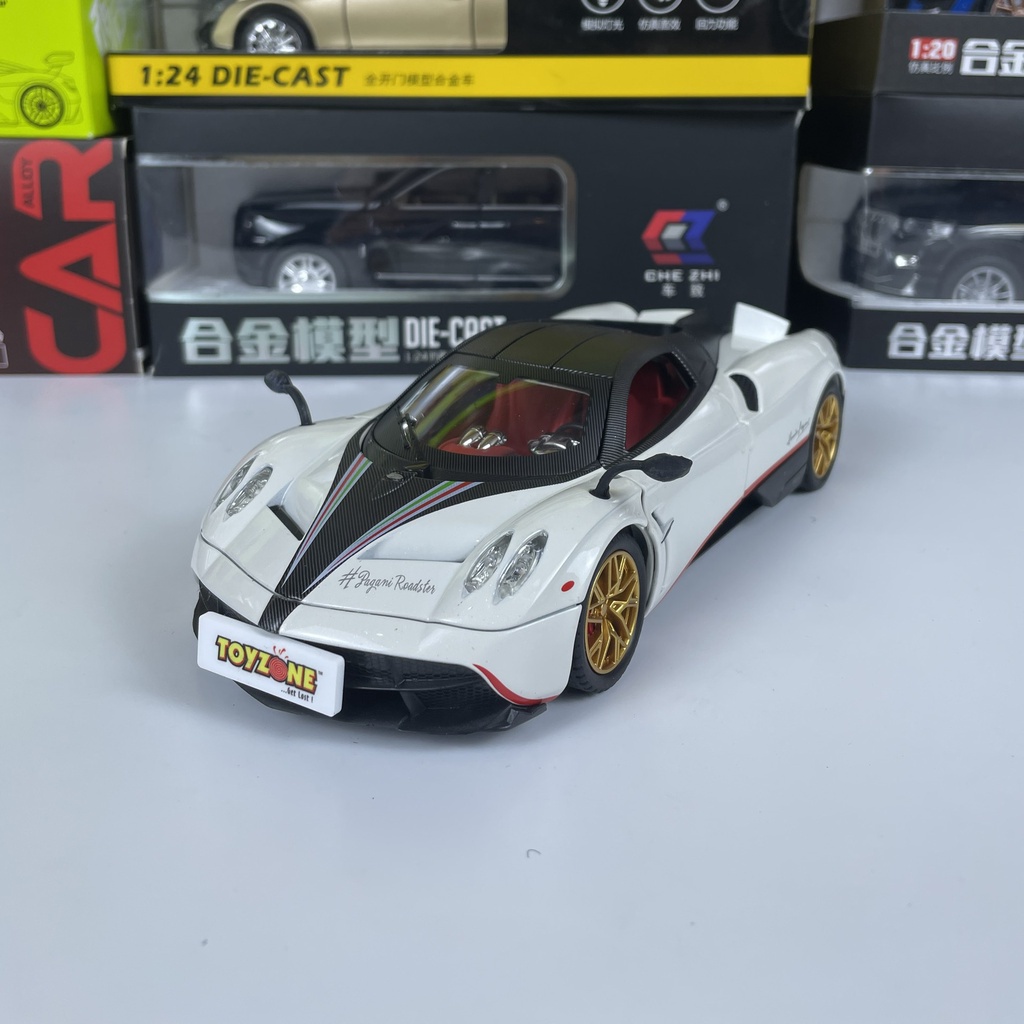 Mô hình siêu xe THẦN GIÓ Pagani Huayra Roadster tỷ lệ 1:24 mở full cửa có đèn, âm thanh, vô lăng đánh lái bấm còi
