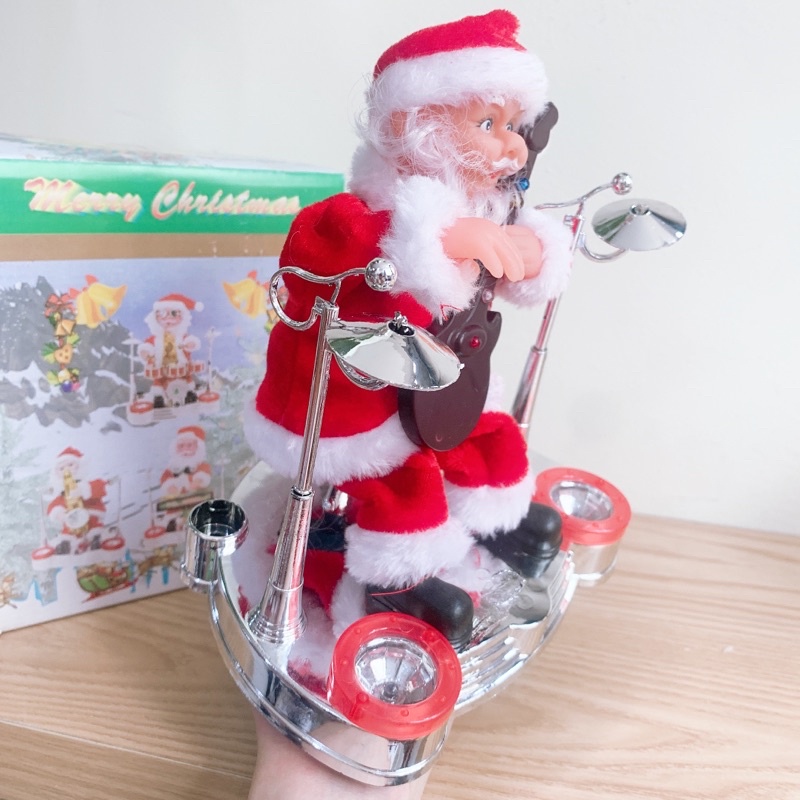 Ông già Noel đánh trống, chơi đàn có đèn và lắc lư theo nhạc vui nhộn, quà tặng giáng sinh