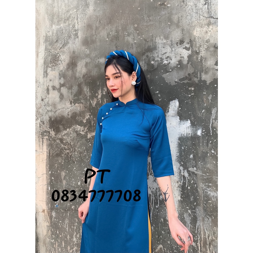 Áo dài nữ cách tân màu xanh trơn kèm mấn xinh cho các chị em