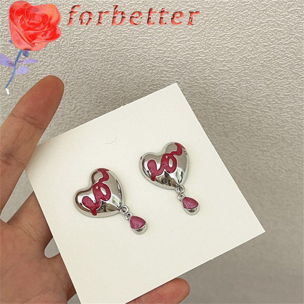 Khuyên tai hình trái tim phối tua rua cá tính cho nữ