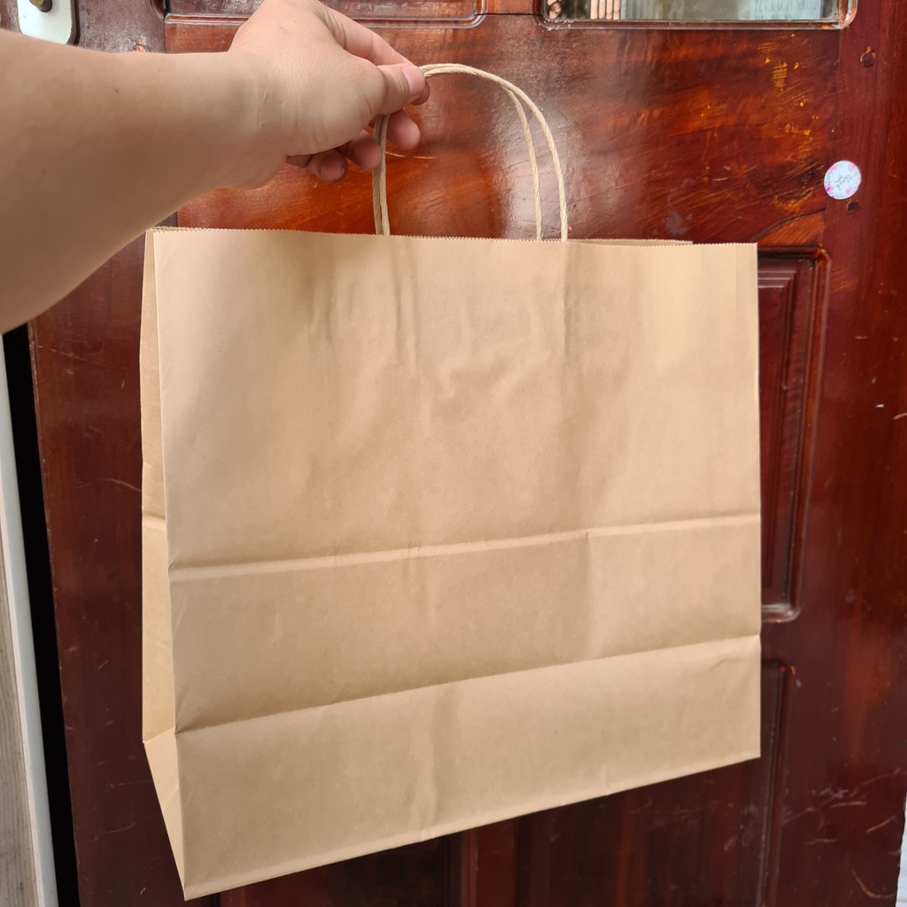 Thanh Lý - Túi giấy Kraft đã in logo 1 mặt, giấy dày, quai chắc chắn