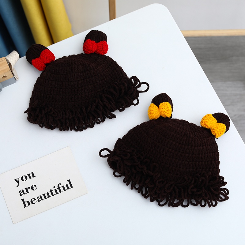 Mũ Len Trùm Đầu Đính Nơ Và Tóc Giả Cho Bé