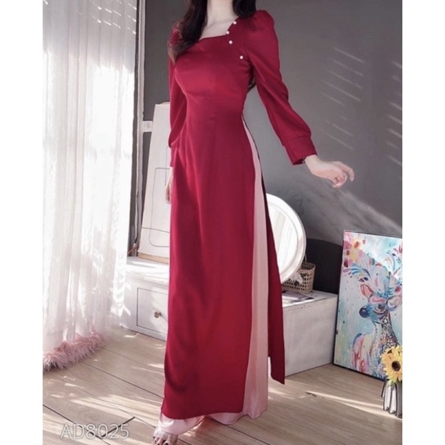 Áo dài lụa màu đỏ đô tươi tay bồng bo gấu thiết kế ngực cách điệu.