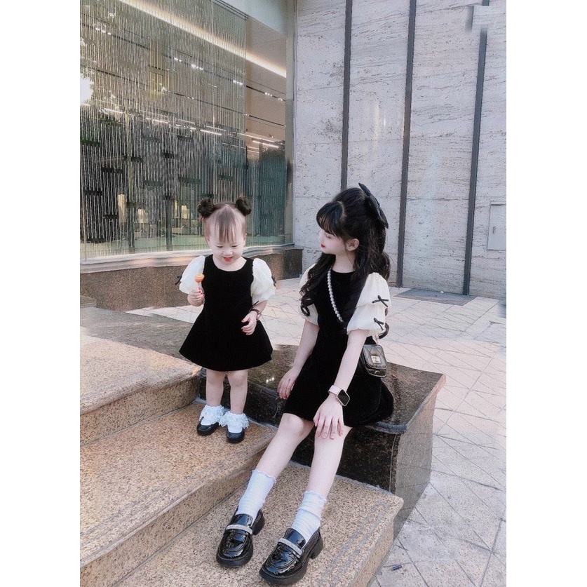 BÁN SỈ VÁY BÉ GÁI NHUNG ĐEN TAY BE ĐÍNH NƠ