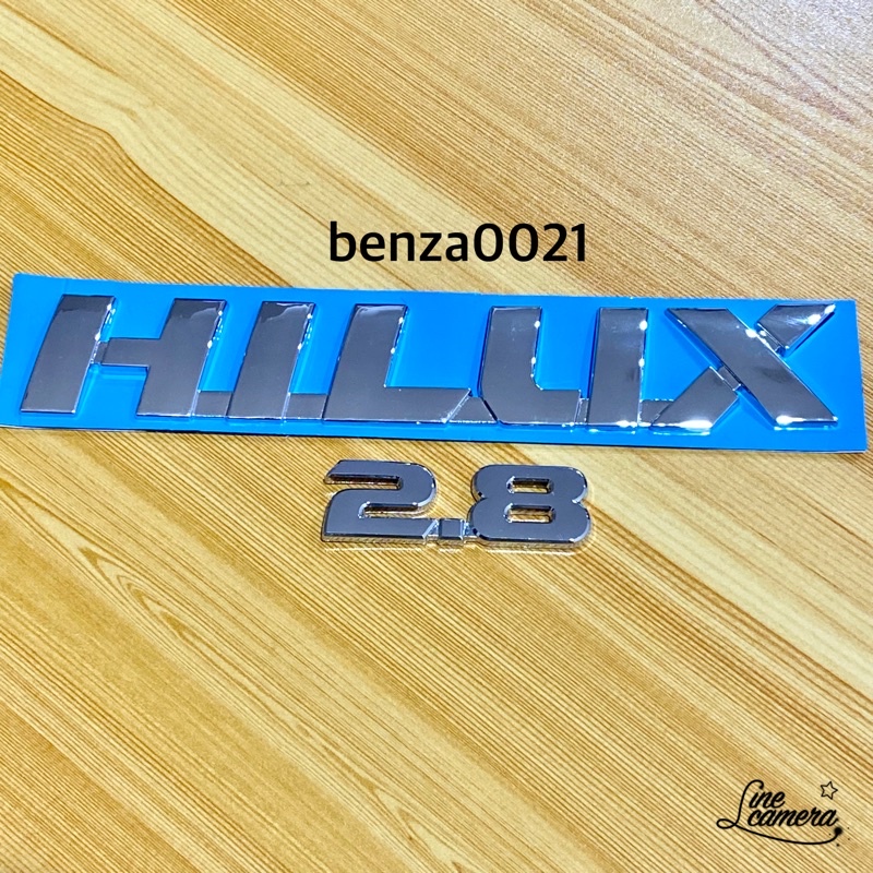 Bộ 2 món bên cửa Hilux + 2.8 Logo Toyota Hilux Revo