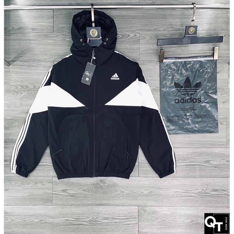 Áo khoác gió adidas nam nữ pha màu có mũ 2 lớp dầy dặn , chất liệu vải cotton pha dù