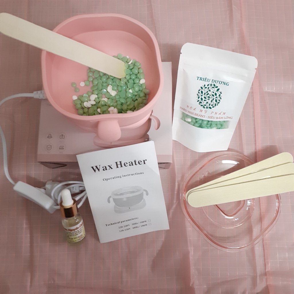 1 nồi nấu sáp wax lông silicon bỏ túi + sáp 50g màu Triêu Dương + Mỡ trăn 10ml. Tặng que wax