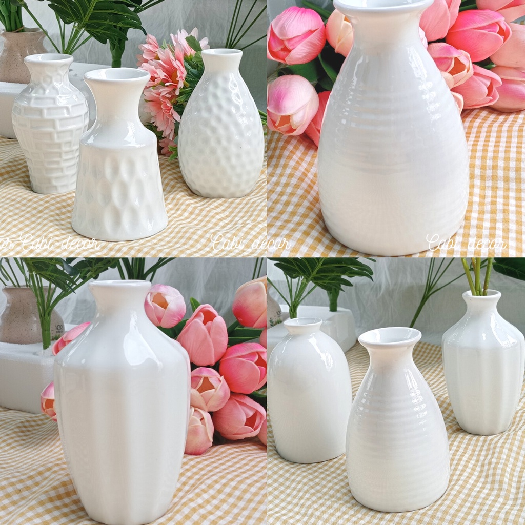 Lọ cắm hoa trang trí nhà cửa làm bằng gốm sứ men trắng phong cách hiện đại.