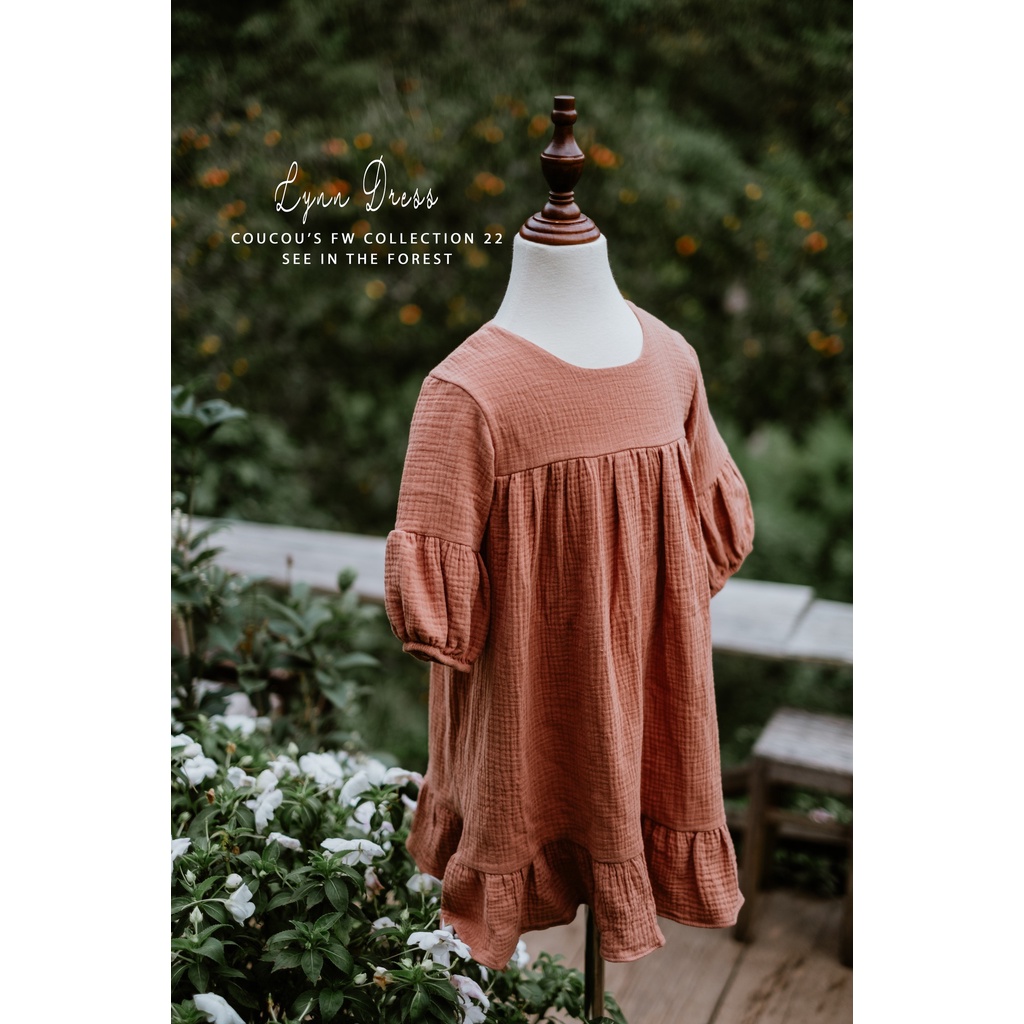 Đầm em bé màu nâu nơ trắng vải xô Muslin Lynn Dress by CouCou