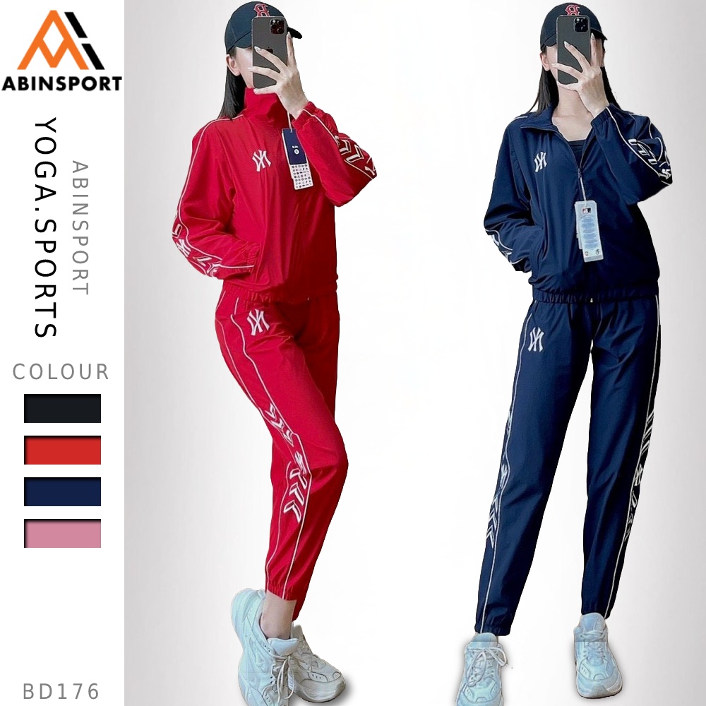 Bộ thể thao nữ thu đông bao gồm áo dài tay và quần dài ống bo có túi vải si gió 1 lớp co dãn logo thêu BD176