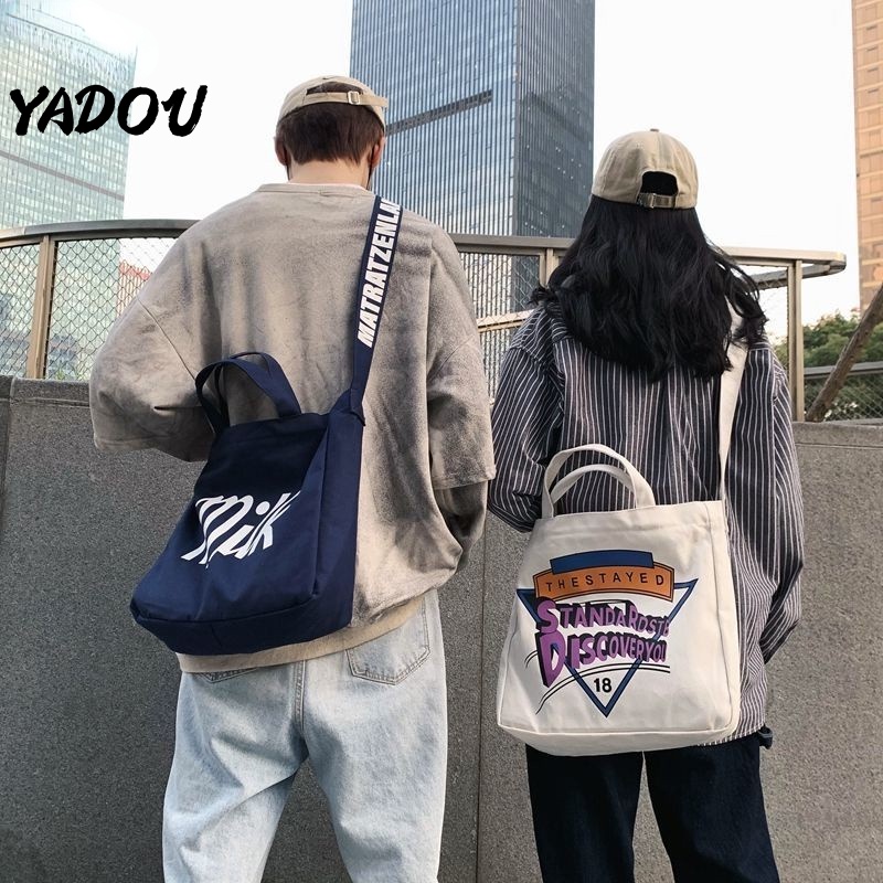 Túi đeo chéo vai YADOU bằng chất vải canvas có sức chứa lớn phong cách Harajuku Hàn Quốc dành cho nam và nữ