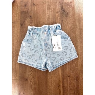Quần short jean bé gái hình mặt cười