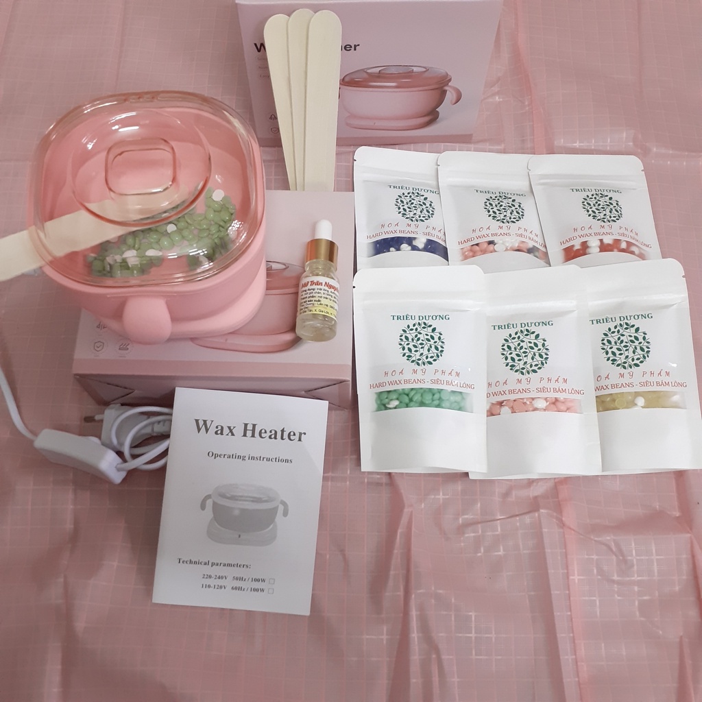 1 nồi nấu sáp wax lông silicon bỏ túi + sáp 50g màu Triêu Dương + Mỡ trăn 10ml. Tặng que wax