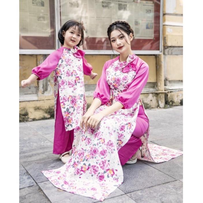 Áo dài cách tân mẹ và bé in hoa màu hồng cánh sen đính nơ cổ điệu đà - M02