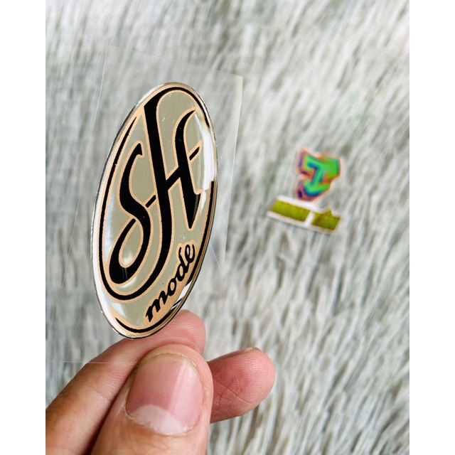 Logo Shmode zin nổi dán mặt nạ xe ( giá 1 tem)