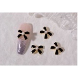 charm nơ trắng đen nail