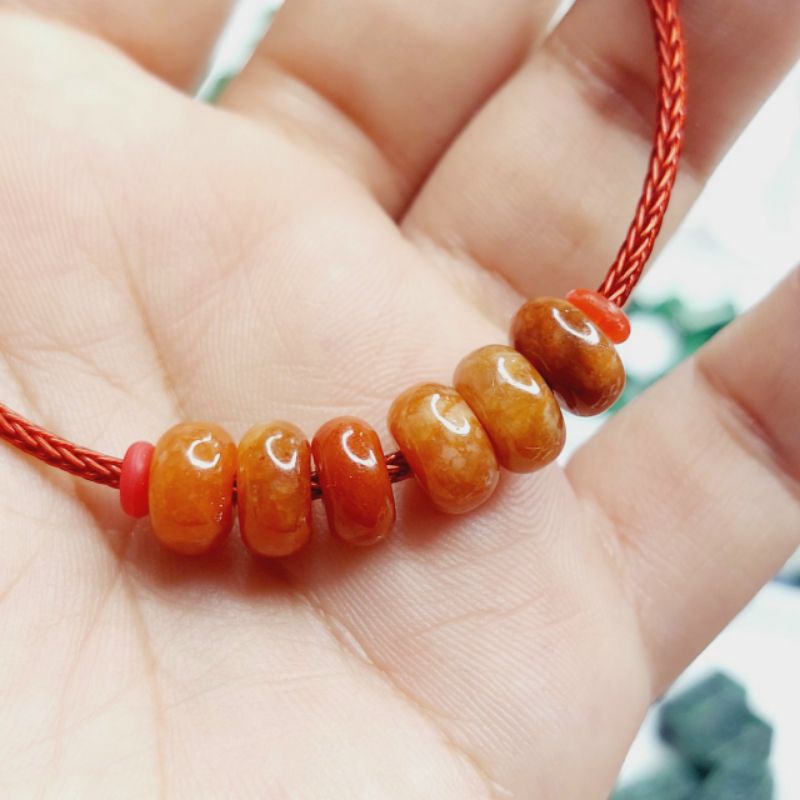 Một đồng điếu tròn xỏ vòng tay CAMTHACH cam UPCARA