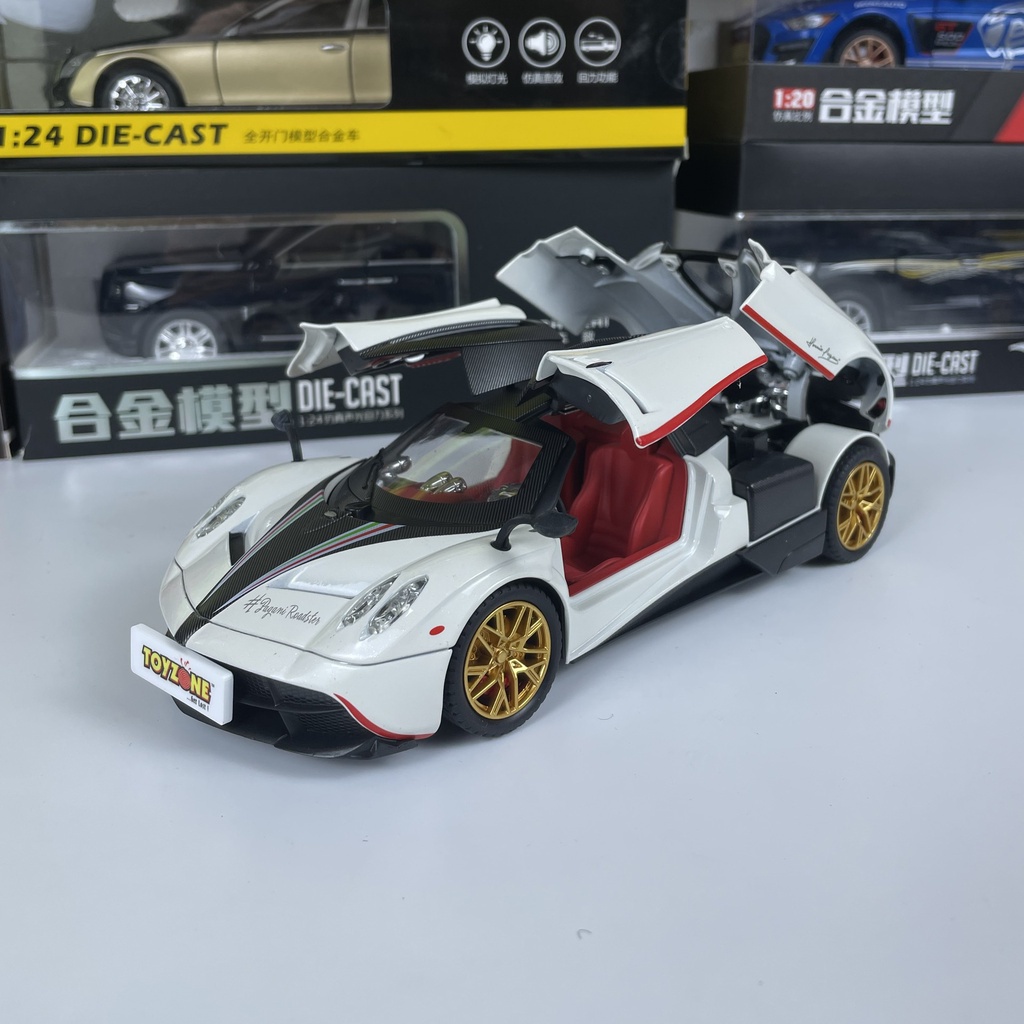 Mô hình siêu xe THẦN GIÓ Pagani Huayra Roadster tỷ lệ 1:24 mở full cửa có đèn, âm thanh, vô lăng đánh lái bấm còi